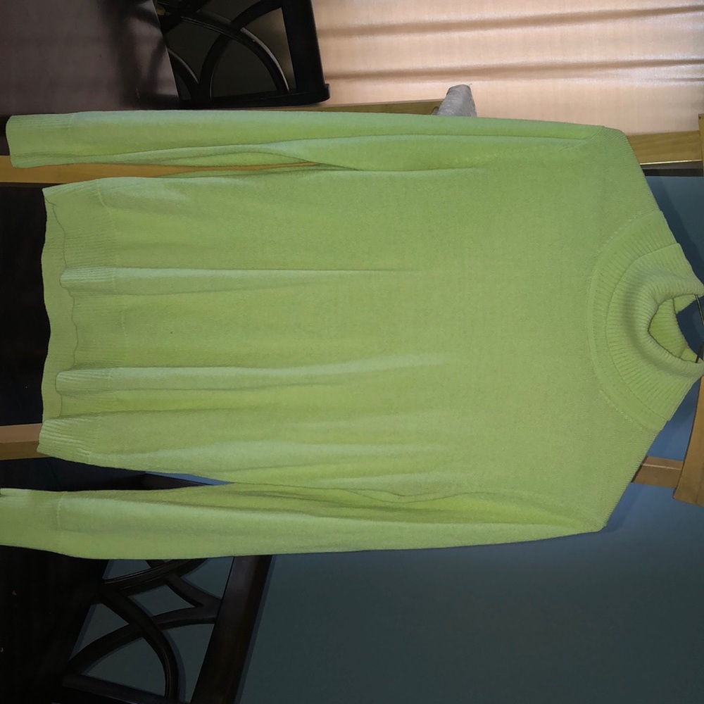 Pastel green turtle neck.